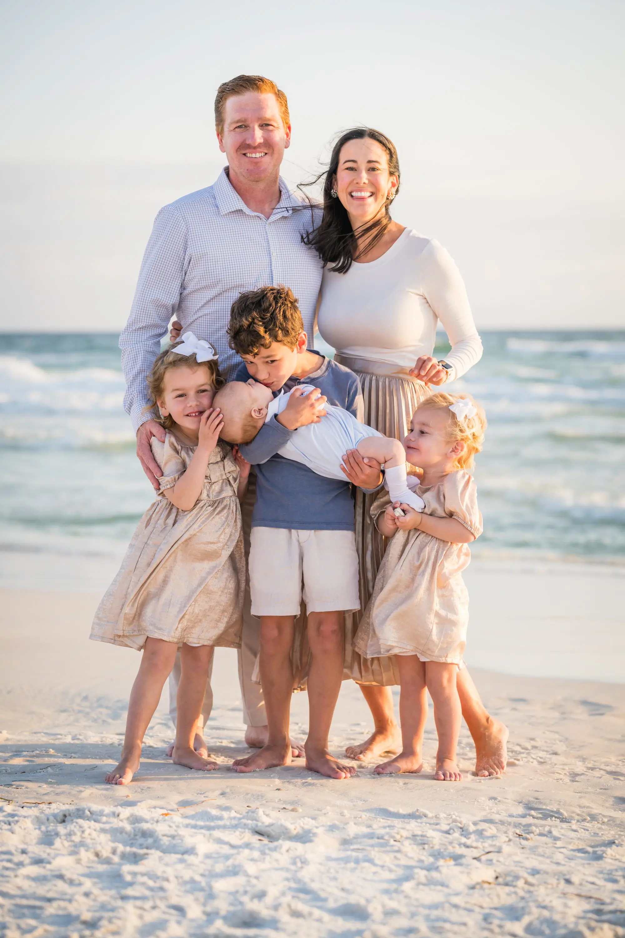 Grandfather playing with grandchildren during a relaxed beach session