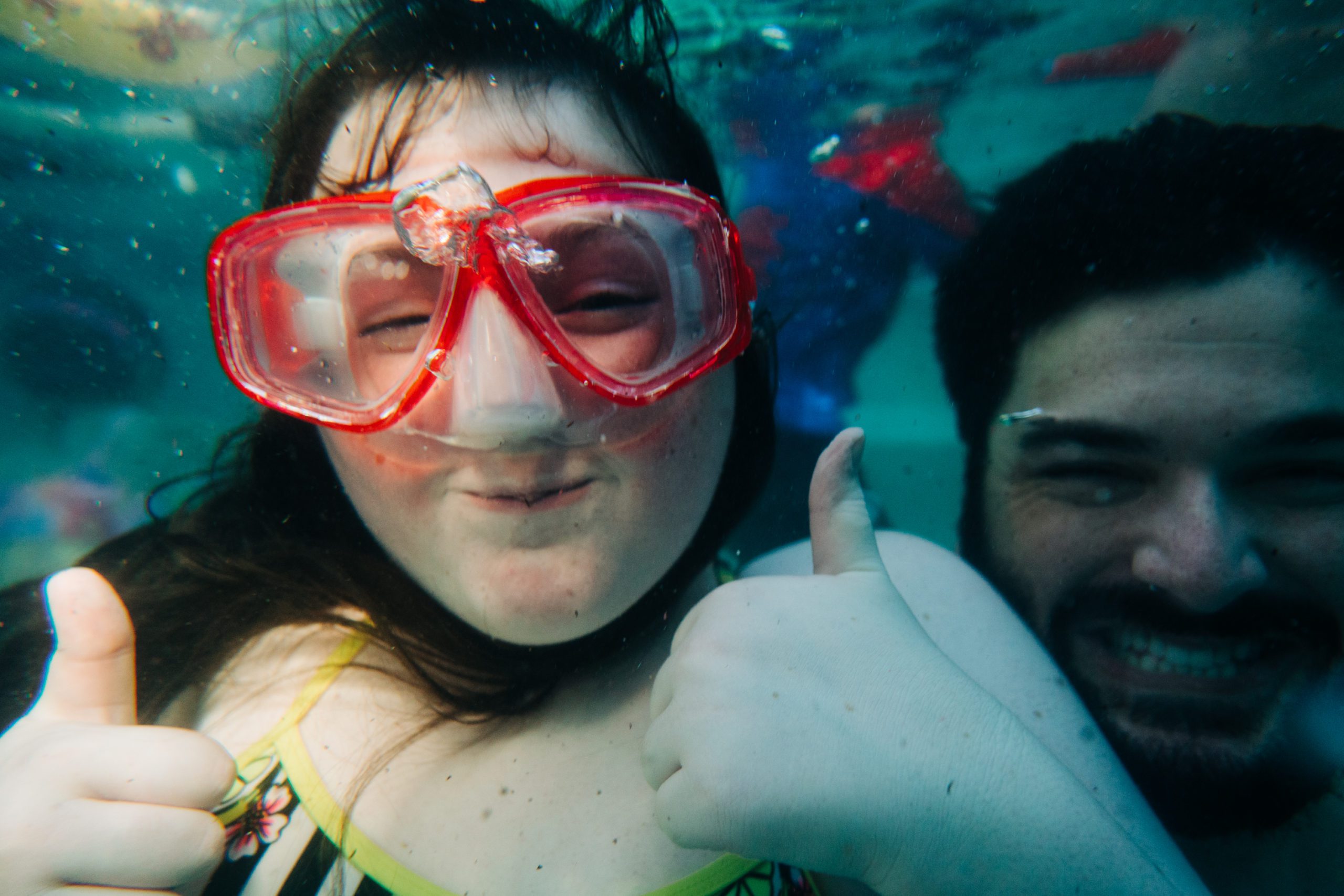 father and daughter underwater