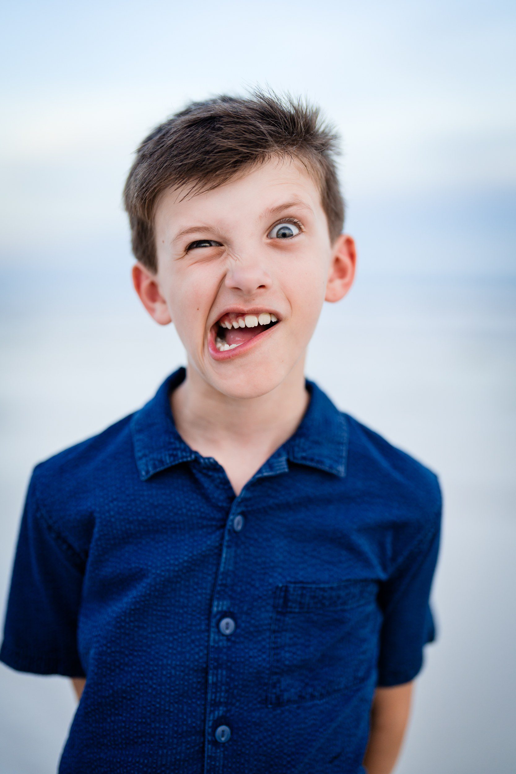 Child showing natural personality during a family beach photography session